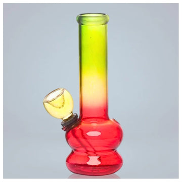 Gradient red to green glass water pipe on a gray background