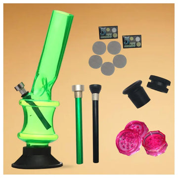Green glass smoking accessory set with accessories on a beige background