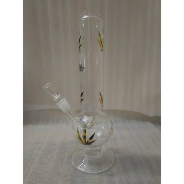 A 12 inch clear glass water bong with leaf print designs along its body.