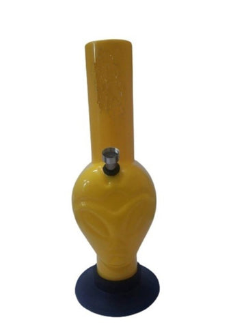 A yellow acrylic waterpipe bong with an alien face shape on a white background.