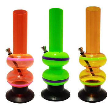 This image displays three Moksha 12" double bulb acrylic water bongs, each featuring a vibrant, neon color. From left to right, the bongs are colored orange, green, and yellow, providing a striking visual appeal.