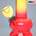 Red and yellow glass smoking device with 'METIER' branding on a gray background