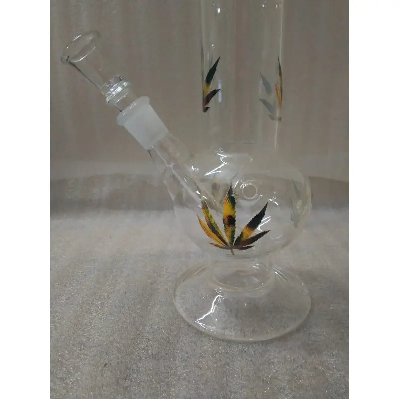 A 12 inch clear glass water bong with a leaf print and feather design, featuring a single bulb and a hookah-style base.