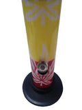 A 12 inch tall acrylic waterpipe bong with leaf patterns and rasta colors predominantly in yellow, red, and black.