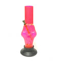 A pink acrylic waterpipe smoking bong with a skull face design on a white background.
