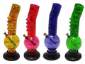 A set of four colorful acrylic bongs with a marble-like pattern, each in different colors: yellow, red, blue, and green. They all have a single bulbous shape and are displayed on a stand.