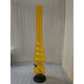 A tall transparent yellow acrylic waterpipe bong with multiple bulbous sections and a base, standing upright.