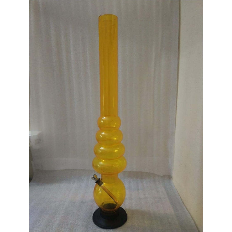 A tall transparent yellow acrylic waterpipe bong with multiple bulbous sections and a base, standing upright.