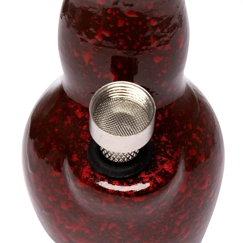 A 4 inch tall red ceramic water bong with a speckled pattern.