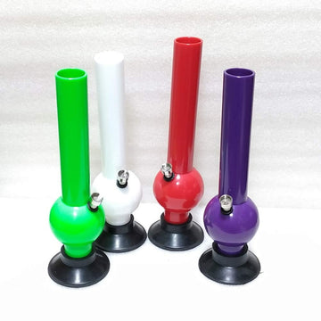 This image displays a collection of four Moksha bongs, each standing at 12 inches tall. These waterpipe smoking bongs are crafted from acrylic, mimicking the appearance of glass but offering enhanced durability and lightweight qualities.