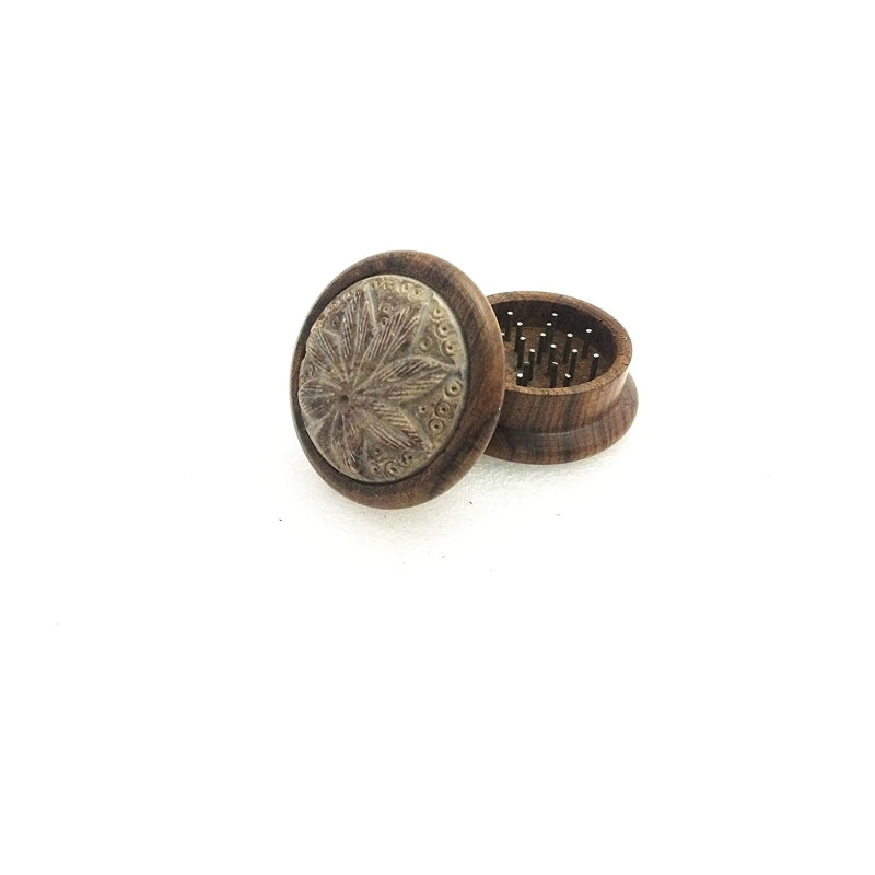 Wooden grinder with stone inlay leaf design